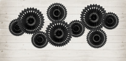 Black rosette backdrop decor arranged on a wall available at our Toronto party shop