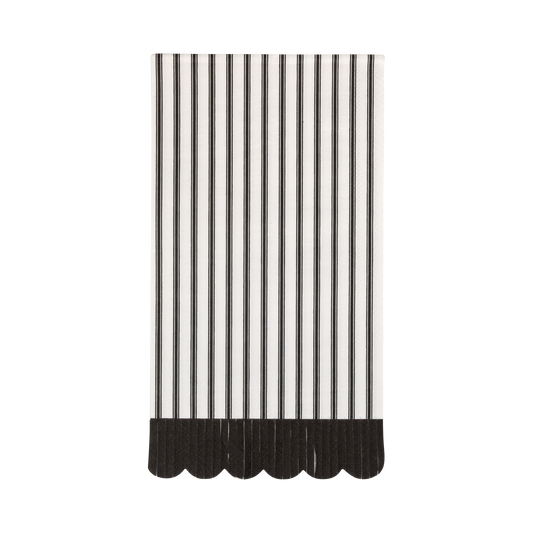 Black and white striped dinner napkins with a scalloped edge on a white background