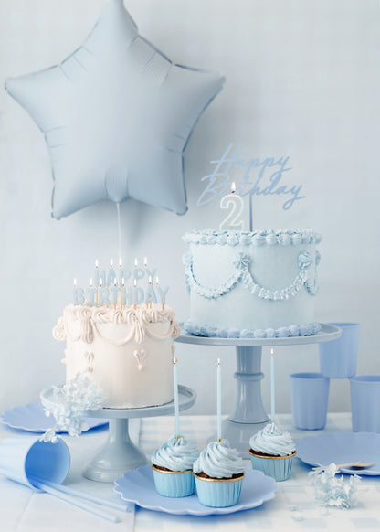 Light blue Happy Birthday candles styled on elegant birthday cakes available in Toronto and shipping across Canada