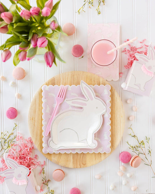 Bunny shaped paper plates styled on a spring Easter table with pink accents and florals, available at Confetti My Party Toronto