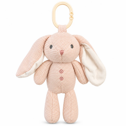 Blush pink knitted bunny stroller plush toy with long floppy ears, cream lining, embroidered face and ivory attachment ring. Pick up in Toronto + Canada-wide shipping available.