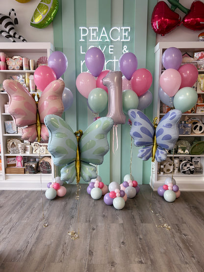 Pastel butterfly birthday balloon bundle with pink, mint and purple butterfly foil balloons, latex balloons and a number 1 balloon.