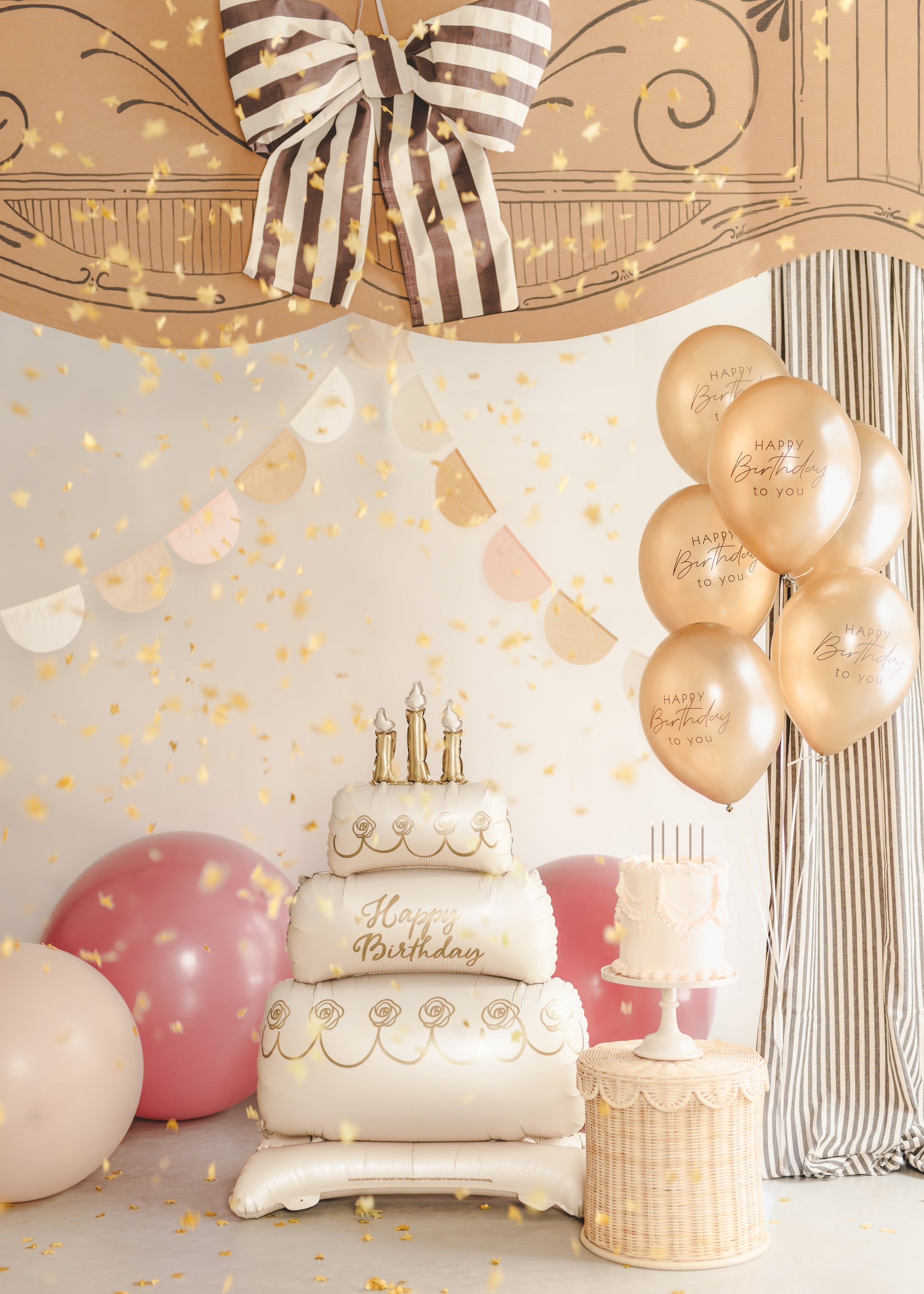 Standing cake foil balloon styled in a soft neutral birthday setup with balloons and decor, available in Toronto and shipping across Canada.