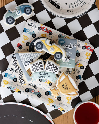 checkered flag table runner with race car paper plate and cookies