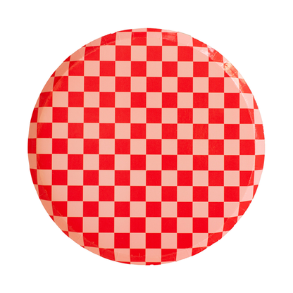 Red checkerboard dinner plate with pink and red square pattern, part of the modern party collection shipping across Canada.
