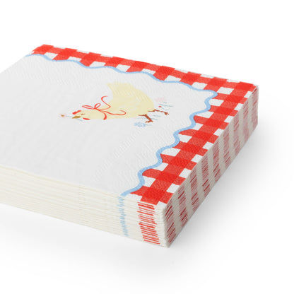 Stack of countryside farm cocktail napkins with hen illustration and red gingham border.