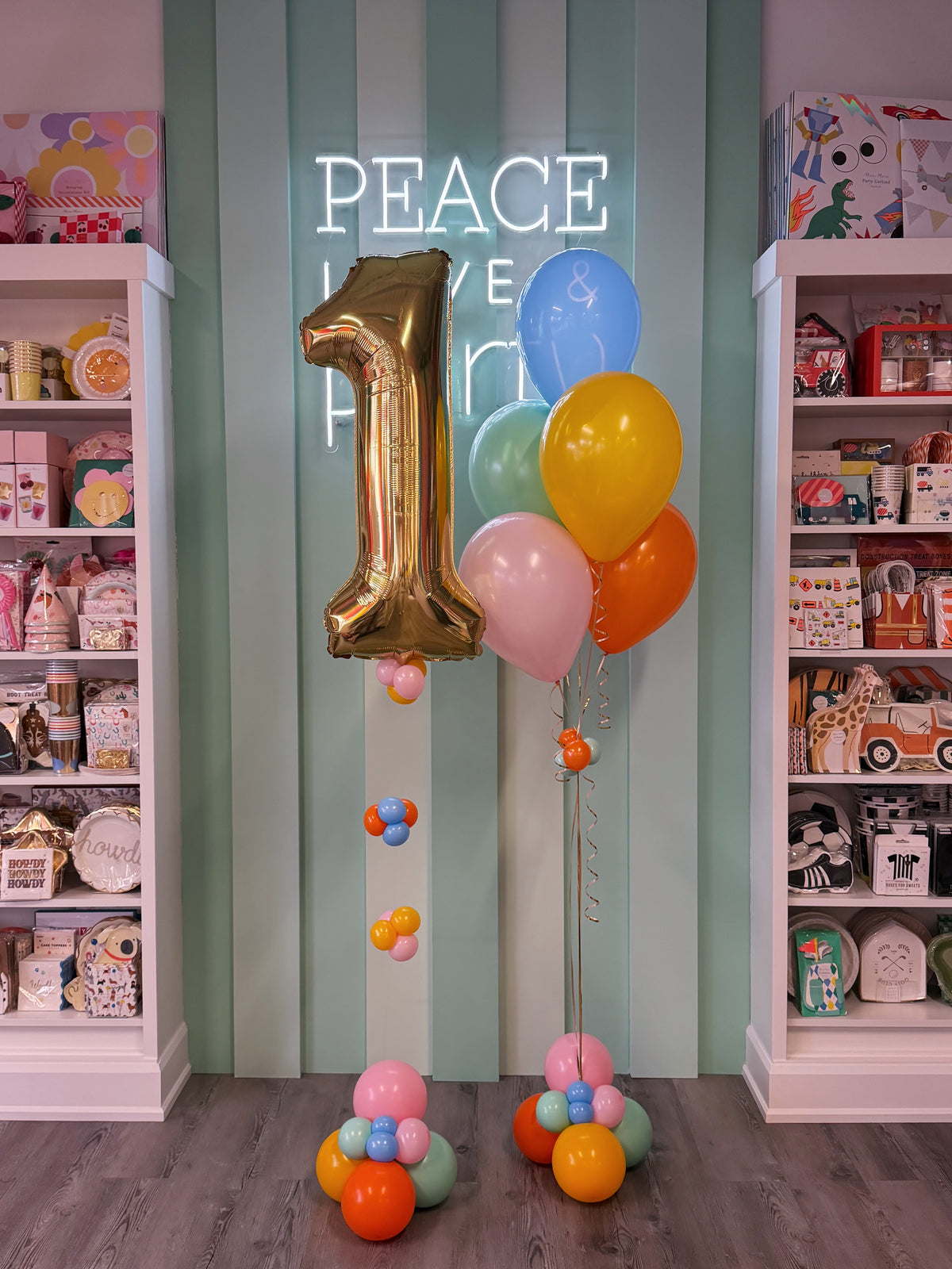 birthday balloons with a white gold foil number and colourful balloon bundle
