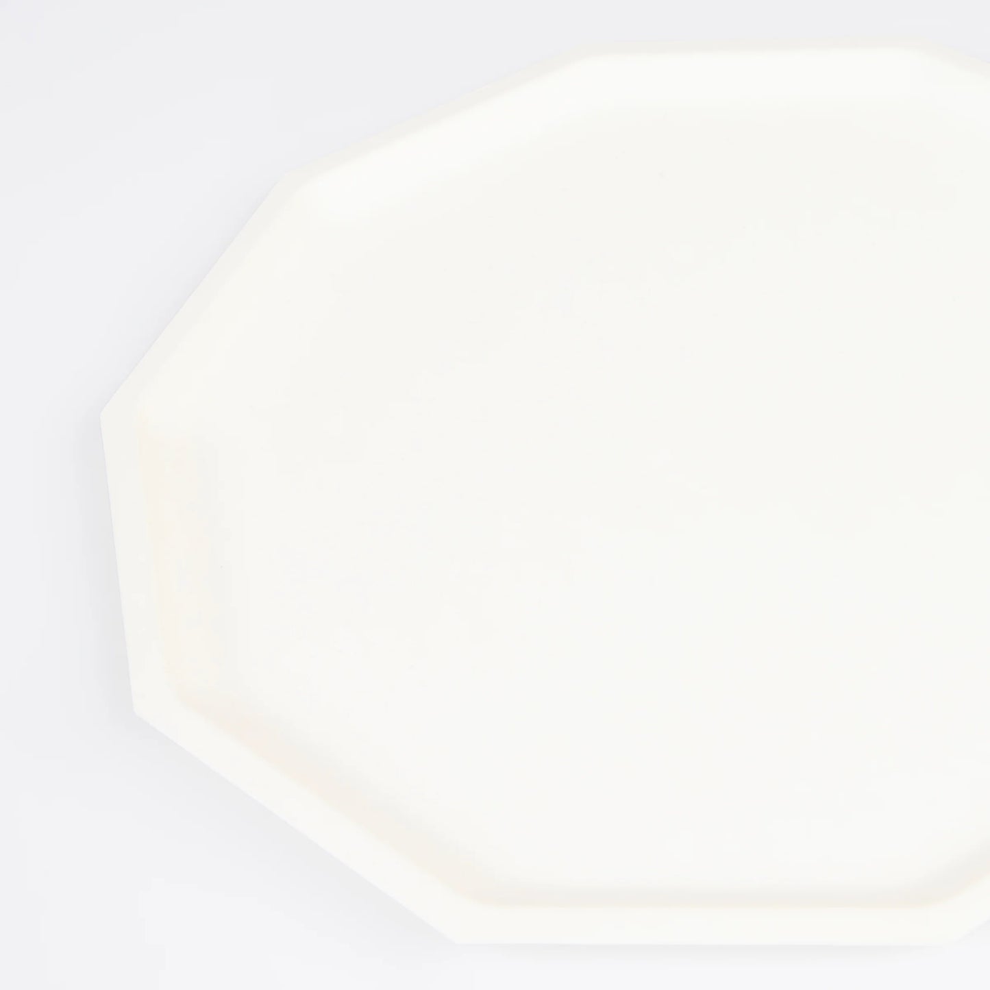 closeup of cream decagon dinner plate