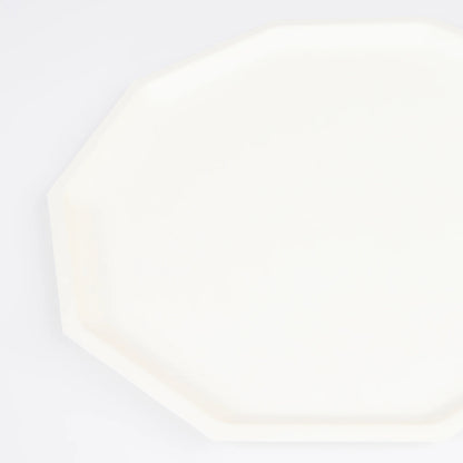 closeup of cream decagon dinner plate