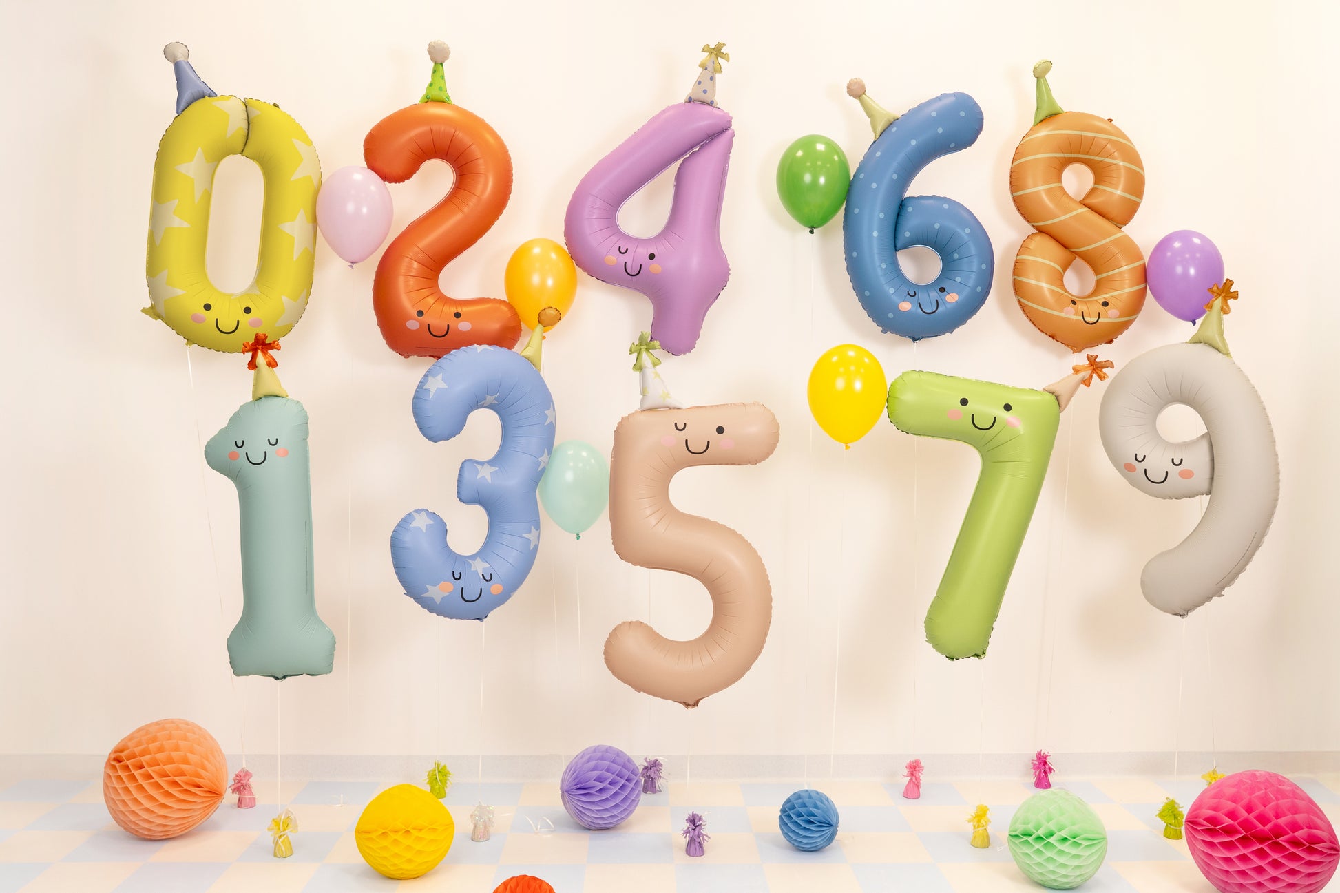 Pastel birthday number foil balloons styled together for a colourful birthday party display available at our Toronto party shop
