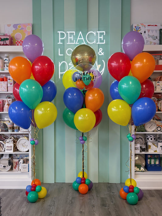 Colourful birthday balloon bouquets with bright latex balloons and a personalized bubble balloon, designed by ConfettiMyParty in Toronto.