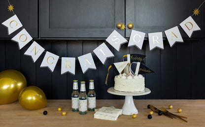Congrats Grad banner styled for a graduation party table, available in Toronto at Confetti My Party