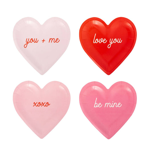Assorted conversation heart–shaped plates with Valentine phrases in pink and red, sold in Toronto at Confetti My Party