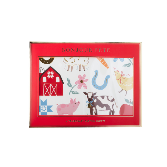 Countryside farm animal temporary tattoos in red Bonjour Fête packaging with cow, pig, chicken, barn and floral designs.