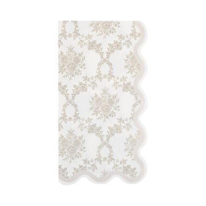 Cream paper guest napkin with delicate grey floral pattern and scalloped edges