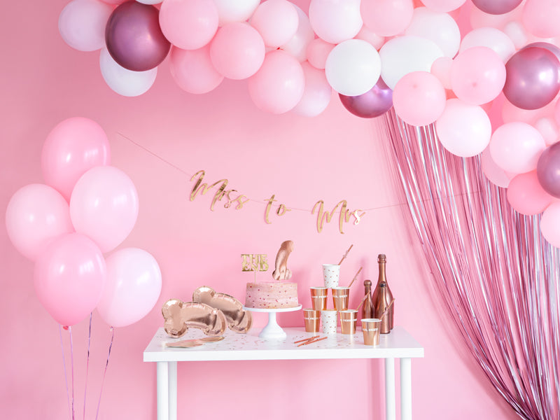 pink curtain backdrop with balloons