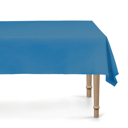 Blue tablecloth on a wooden table with a white background