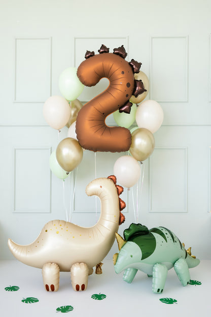 Dinosaur number 2 balloon styled with matching latex balloons in a birthday setup, available in Toronto at Confetti My Party. Ships across Canada.