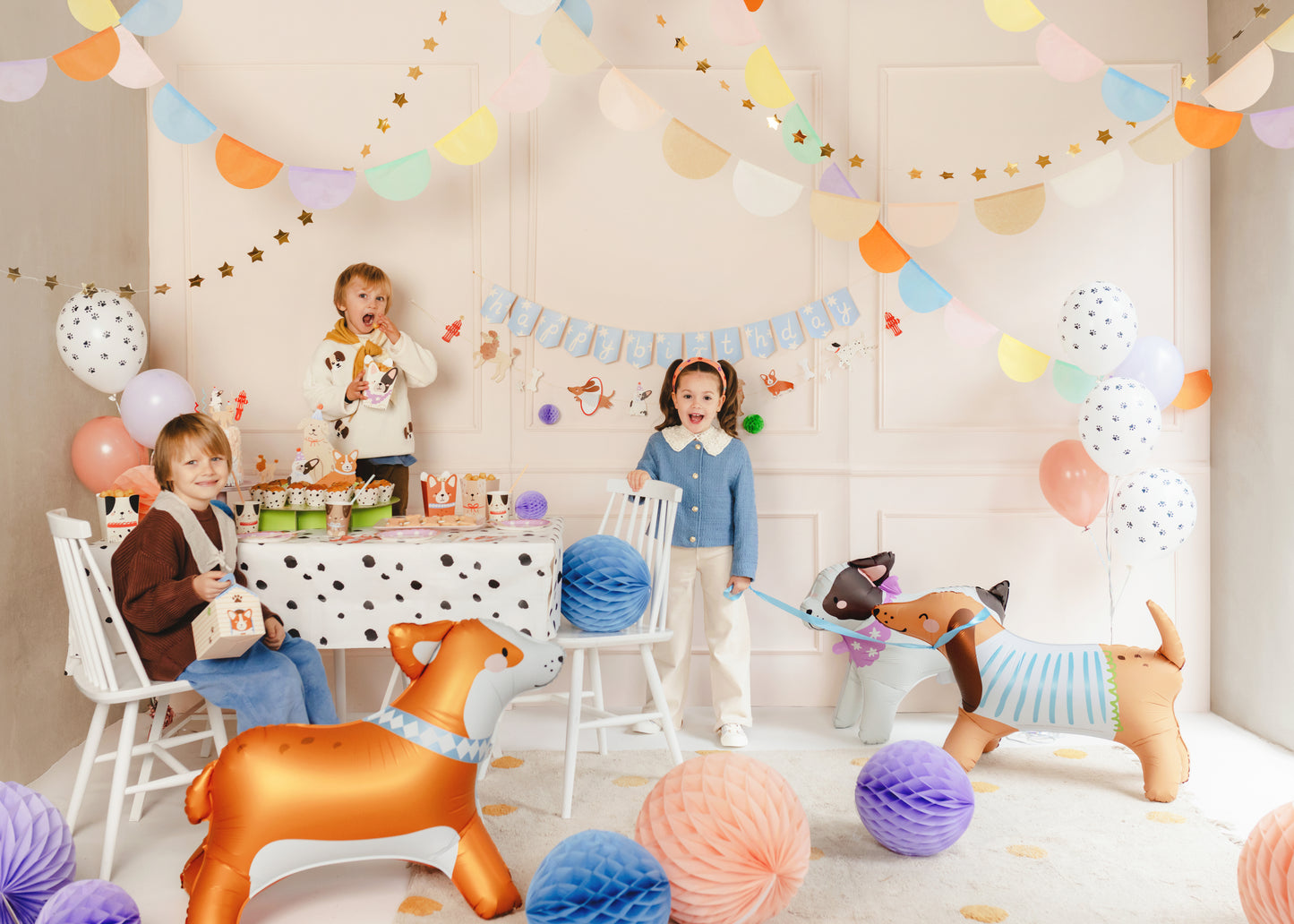 dog party with hanging banner and air walker balloons