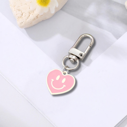 white and pink heart shaped happy face keychain