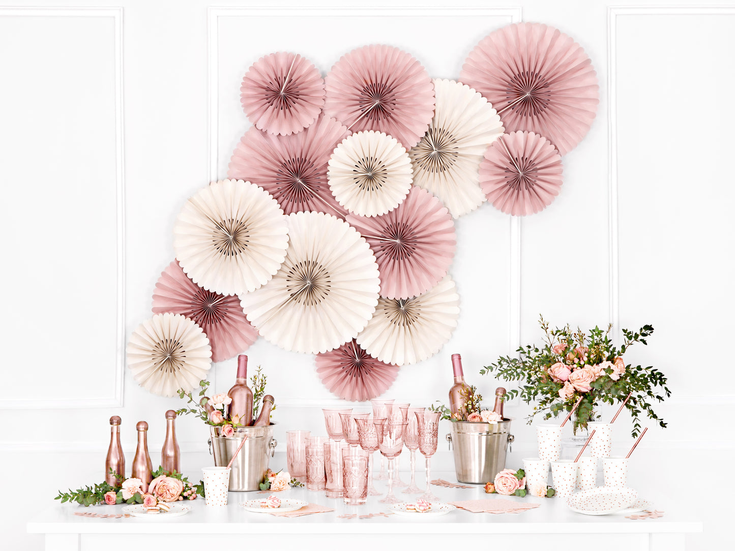 Event setup with dusty rose rosettes and table styling available at our Toronto party shop