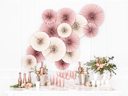 Event setup with dusty rose rosettes and table styling available at our Toronto party shop