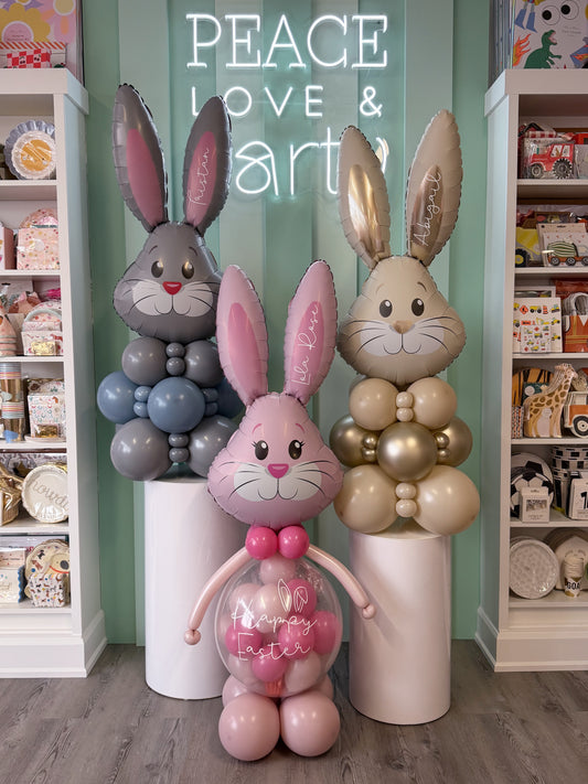 Personalized Easter bunny balloon poppers with custom names in soft pastel colours, available at our Toronto party shop