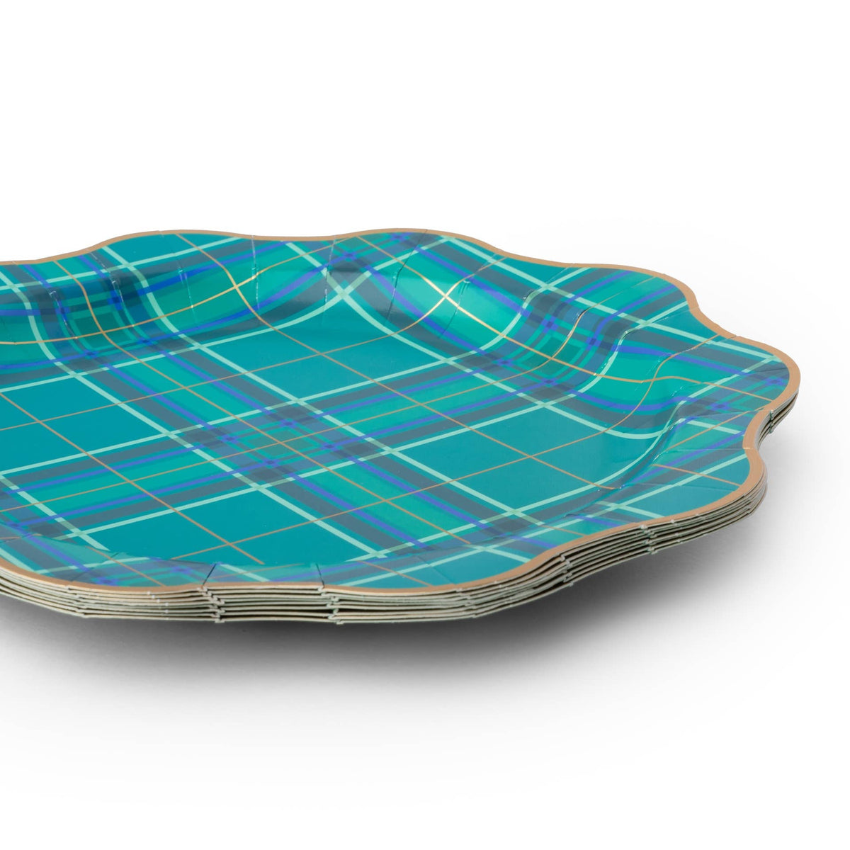Stack of green plaid Christmas dinner plates with blue accents, gold foil details and scalloped edges.