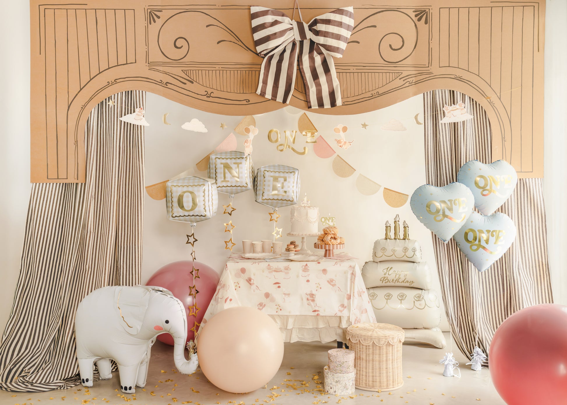 First birthday party setup with standing cake foil balloon and soft neutral decor, available in Toronto and shipping across Canada.