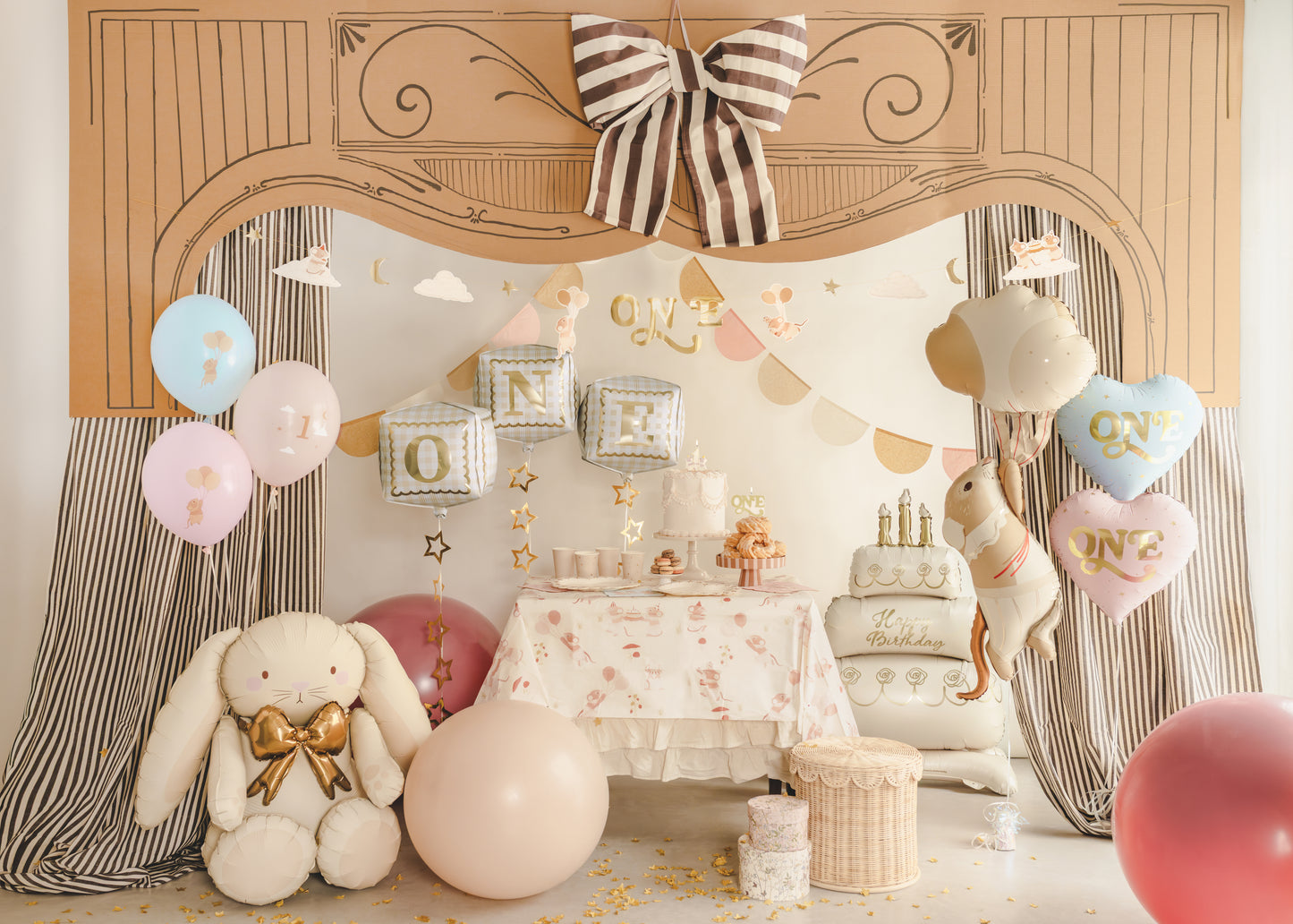 First birthday party setup with “ONE” cube balloons, bow decor, and soft neutral styling, available at our Toronto party shop.