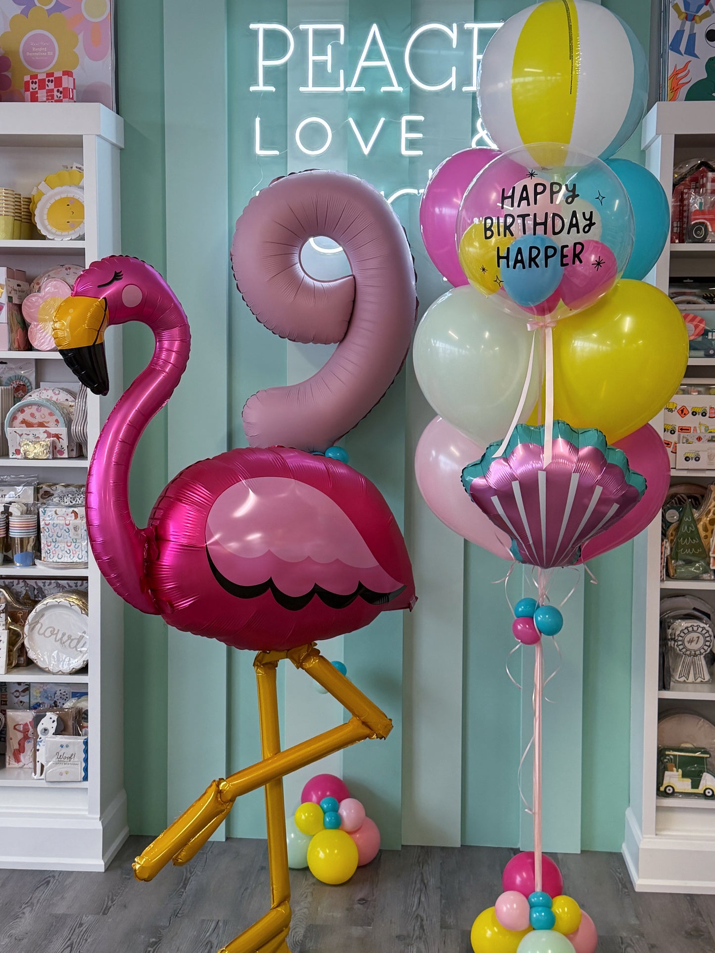 Colourful flamingo birthday balloon bundle with giant pink flamingo, personalized bubble and beach ball balloon in Toronto.