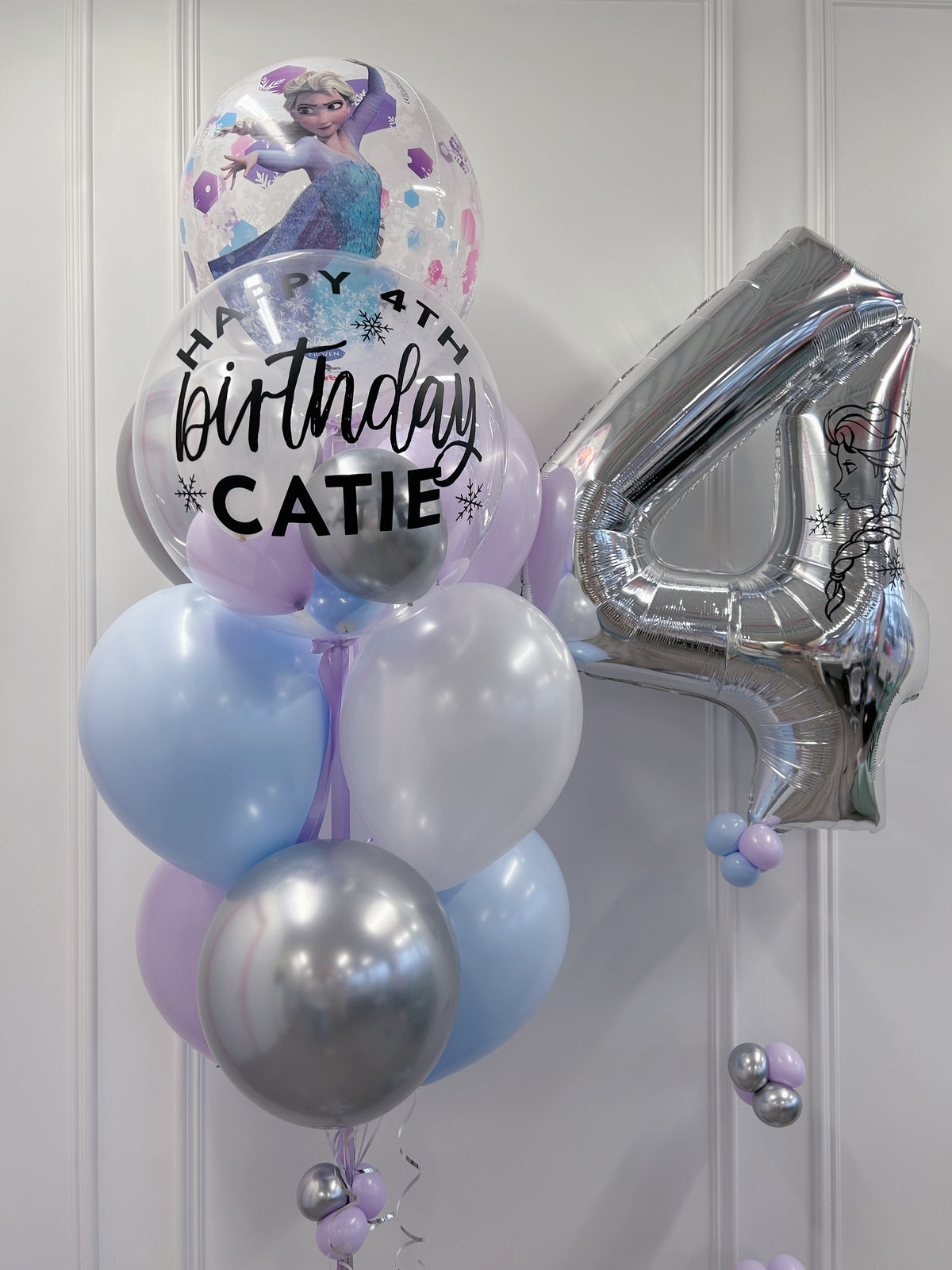 Frozen Elsa birthday balloon bundle featuring a personalized clear bubble + Elsa character balloon + silver number 4 in Toronto.