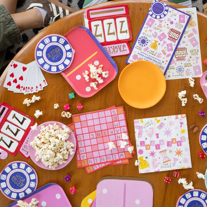 Game night table setup featuring Jackpot napkins, popcorn, dice, and bright retro tableware, available in Toronto and shipping across Canada.