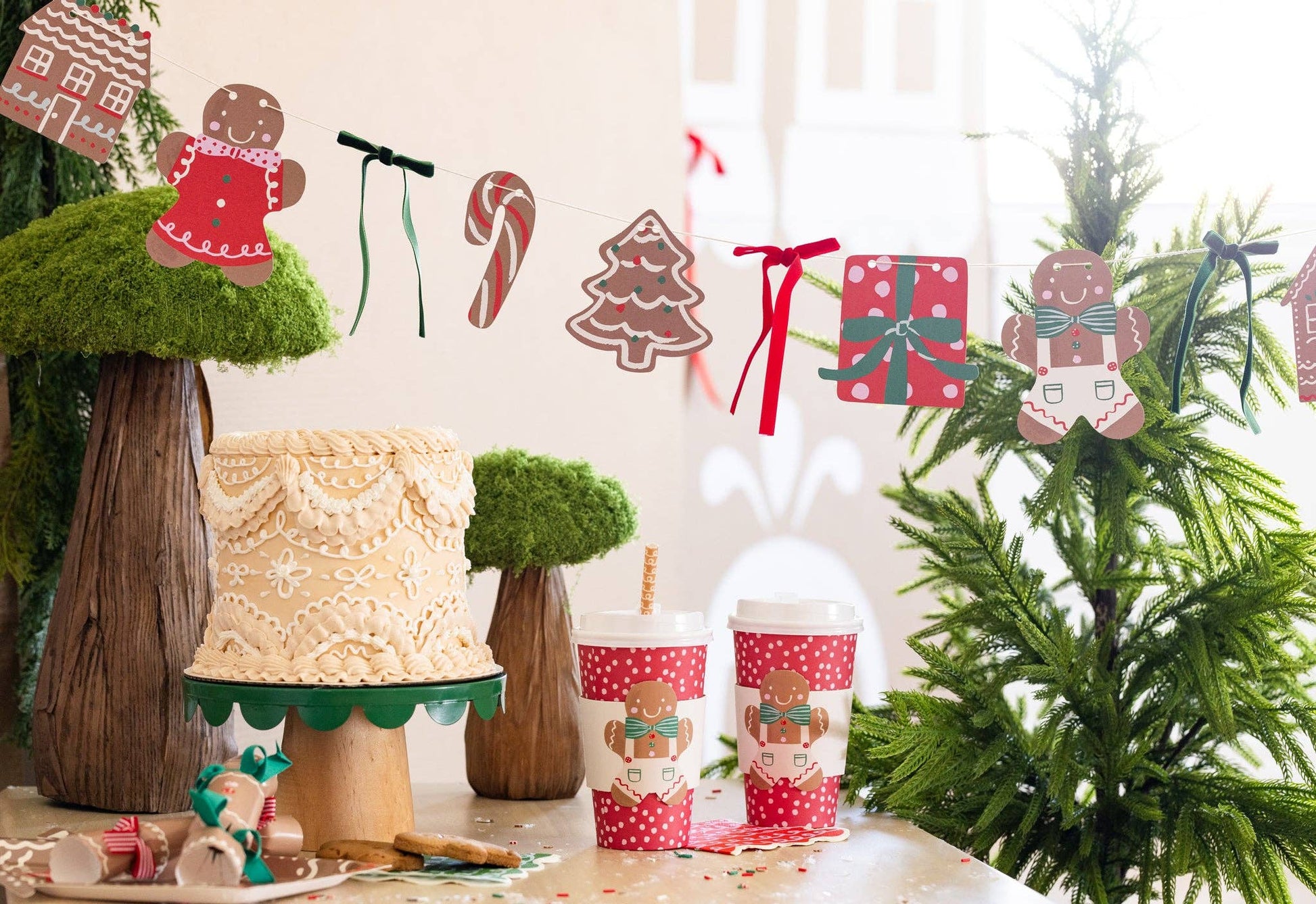Christmas gingerbread garland with candy and present cutouts strung with ribbon, ideal for festive parties