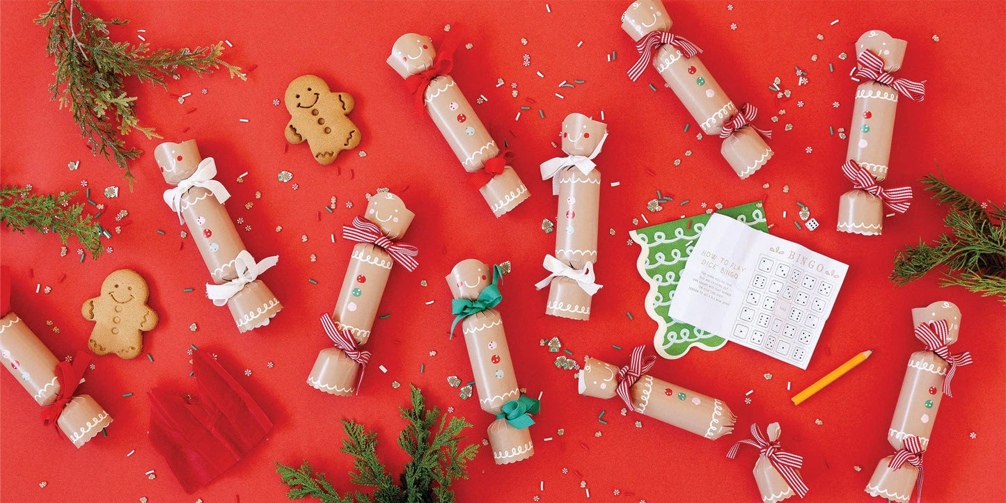 Decorative Christmas crackers and gingerbread cookies. Each included a dice, game and paper crown.