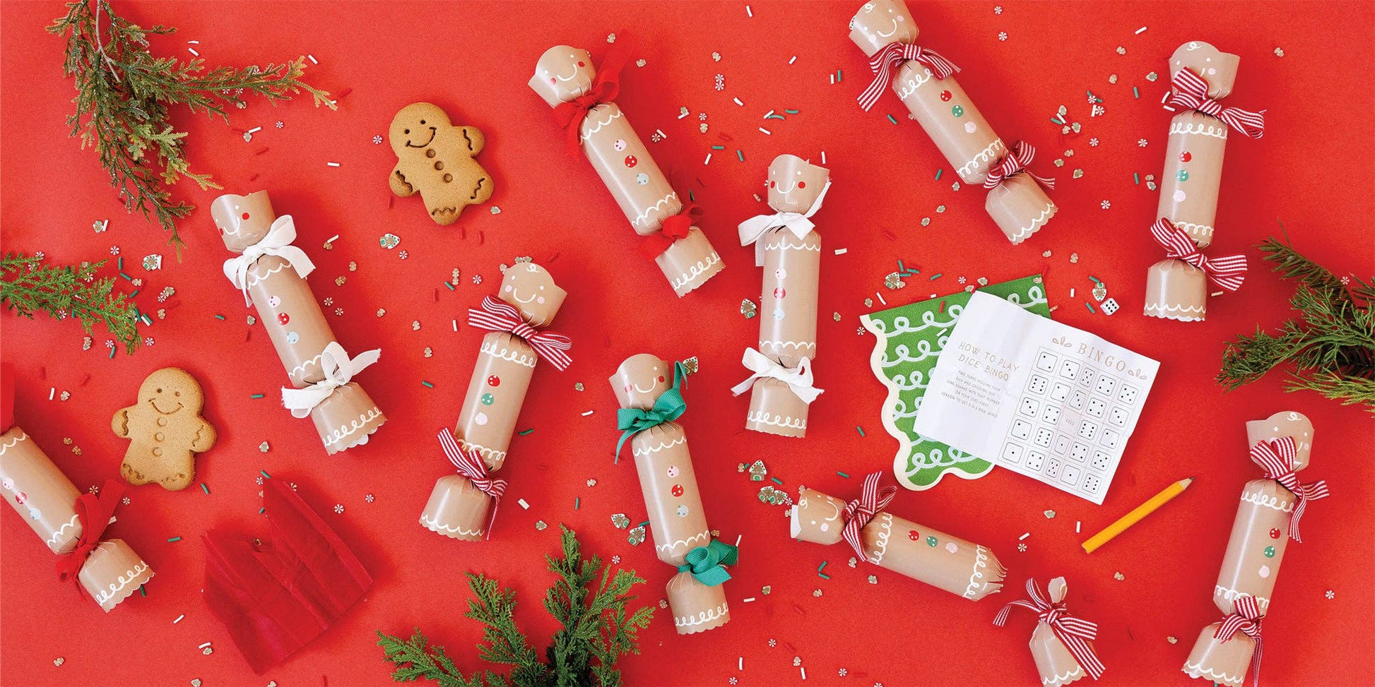 Decorative Christmas crackers and gingerbread cookies. Each included a dice, game and paper crown.