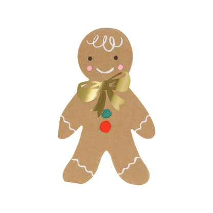 Gingerbread man napkin with a gold bow on a white background