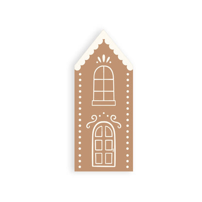 Tall gingerbread house–shaped dinner napkin with white icing details, perfect for Toronto holiday parties.