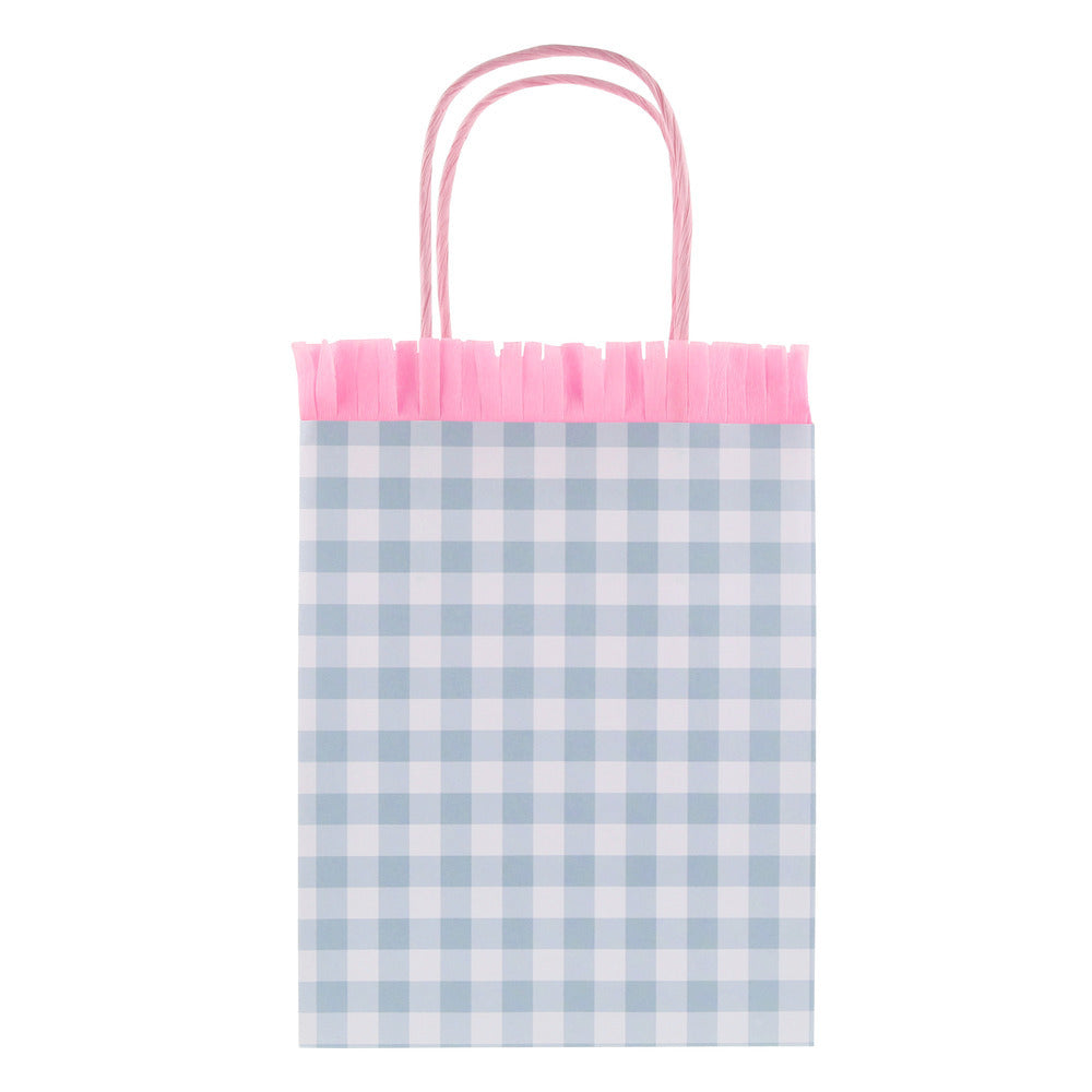 Blue gingham Meri Meri party bag with pink fringe trim and twisted paper handles, available at our Toronto party shop.