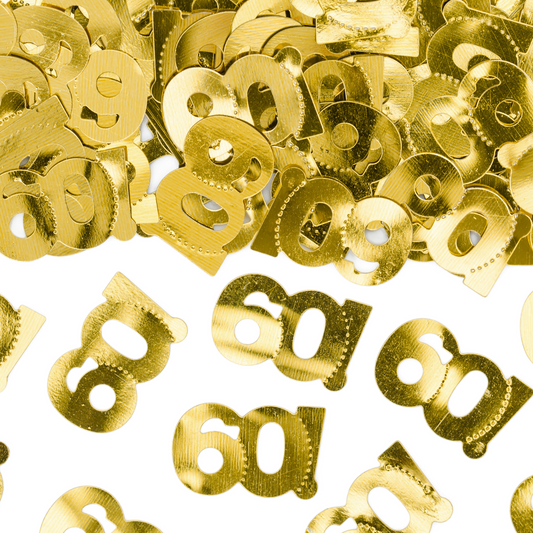 Close-up of shiny metallic gold “60!” confetti pieces, perfect for 50th birthday or anniversary party decorations.