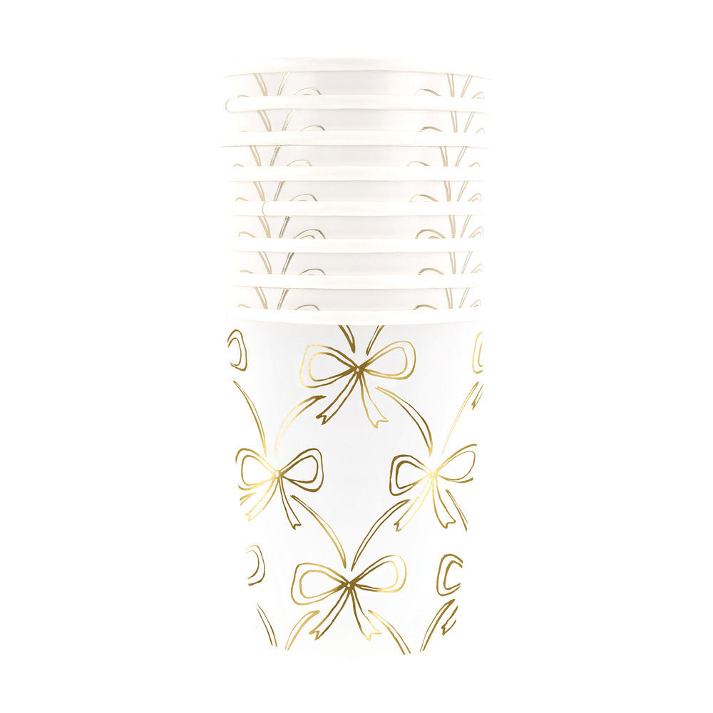 tack of Meri Meri gold bow cups, perfect for elegant parties and celebrations in Toronto.