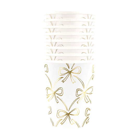 tack of Meri Meri gold bow cups, perfect for elegant parties and celebrations in Toronto.