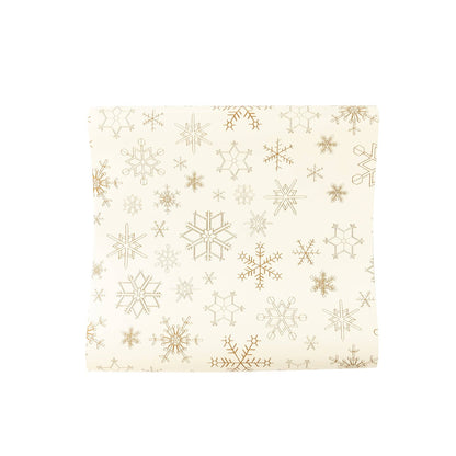Gold snowflakes paper table runner, elegant holiday table decoration for Christmas and winter parties in Toronto.