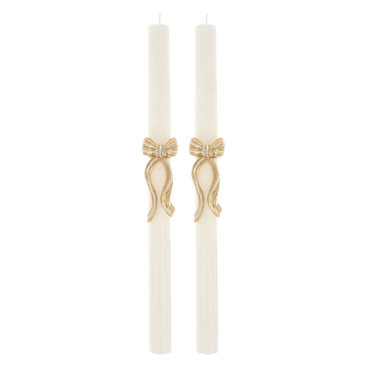 Two white candles with gold decorative bow bands sold in Toronto at Confetti My Party