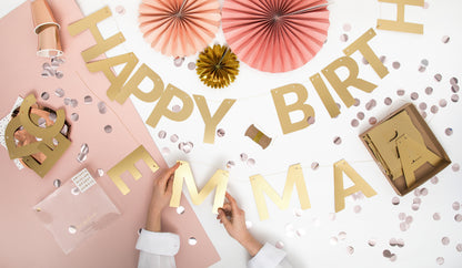 Mirror gold alphabet banner letters being strung on twine with party décor, sold in Toronto at Confetti My Party. Ships across Canada.