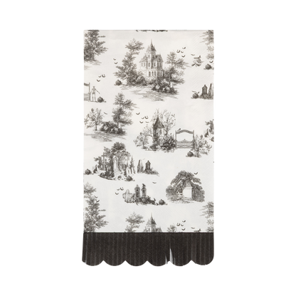 Cream Halloween toile dinner napkins with black haunted house, graveyard and ghost illustrations and scalloped fringe edge.