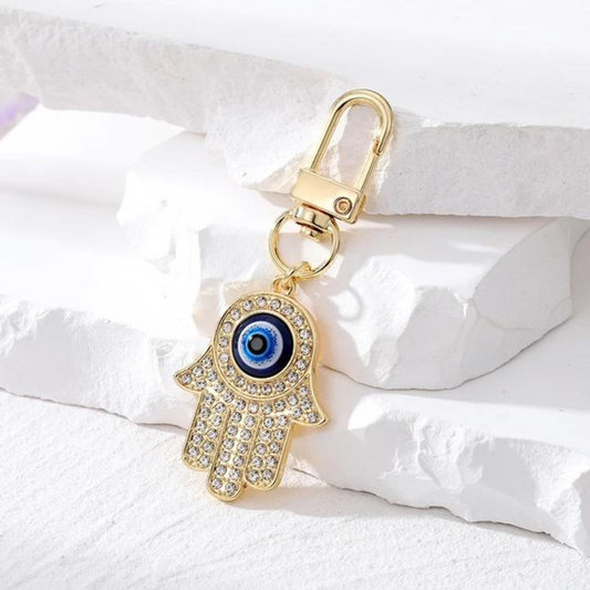 hamsa evil eye keychain with gold and silver details 