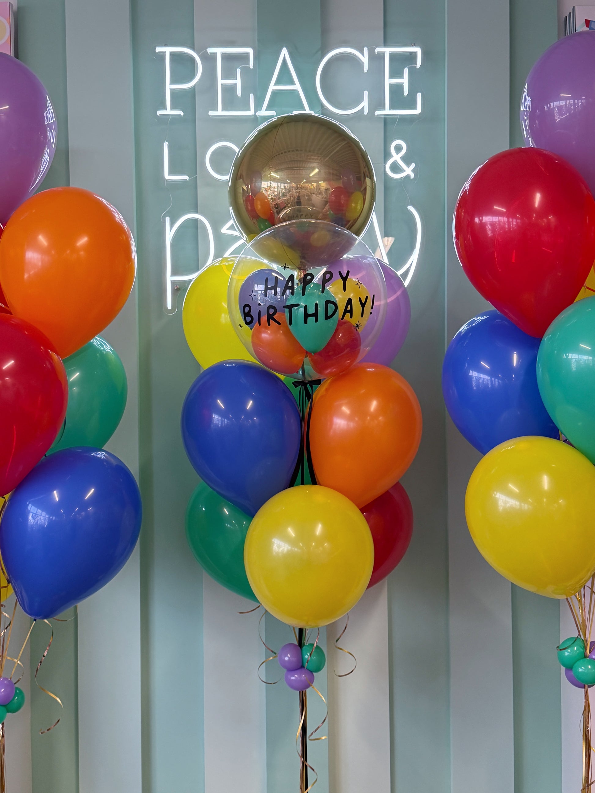 Colourful birthday balloon bouquet with personalized bubble balloon, Orbz balloon and bright latex balloons in Toronto.