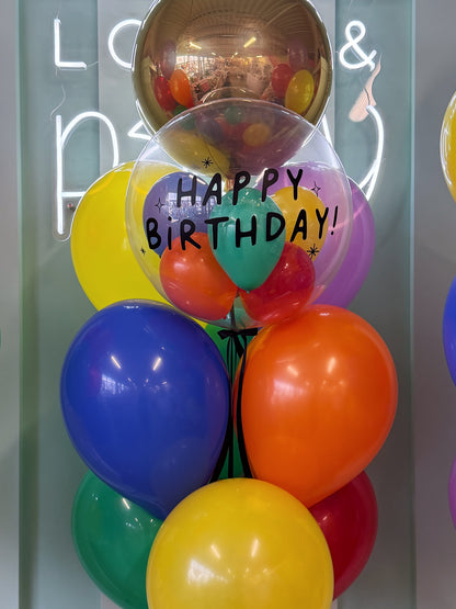 Personalized Happy Birthday bubble balloon filled with colourful mini balloons as part of a birthday balloon bouquet in Toronto.