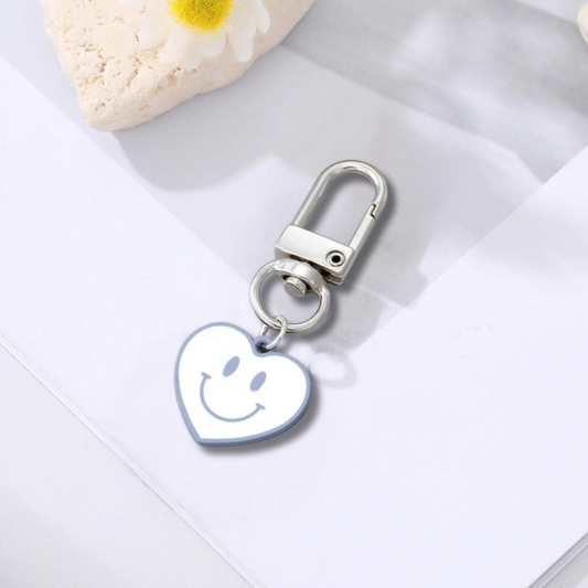 blue and white heart shaped happy face keychain